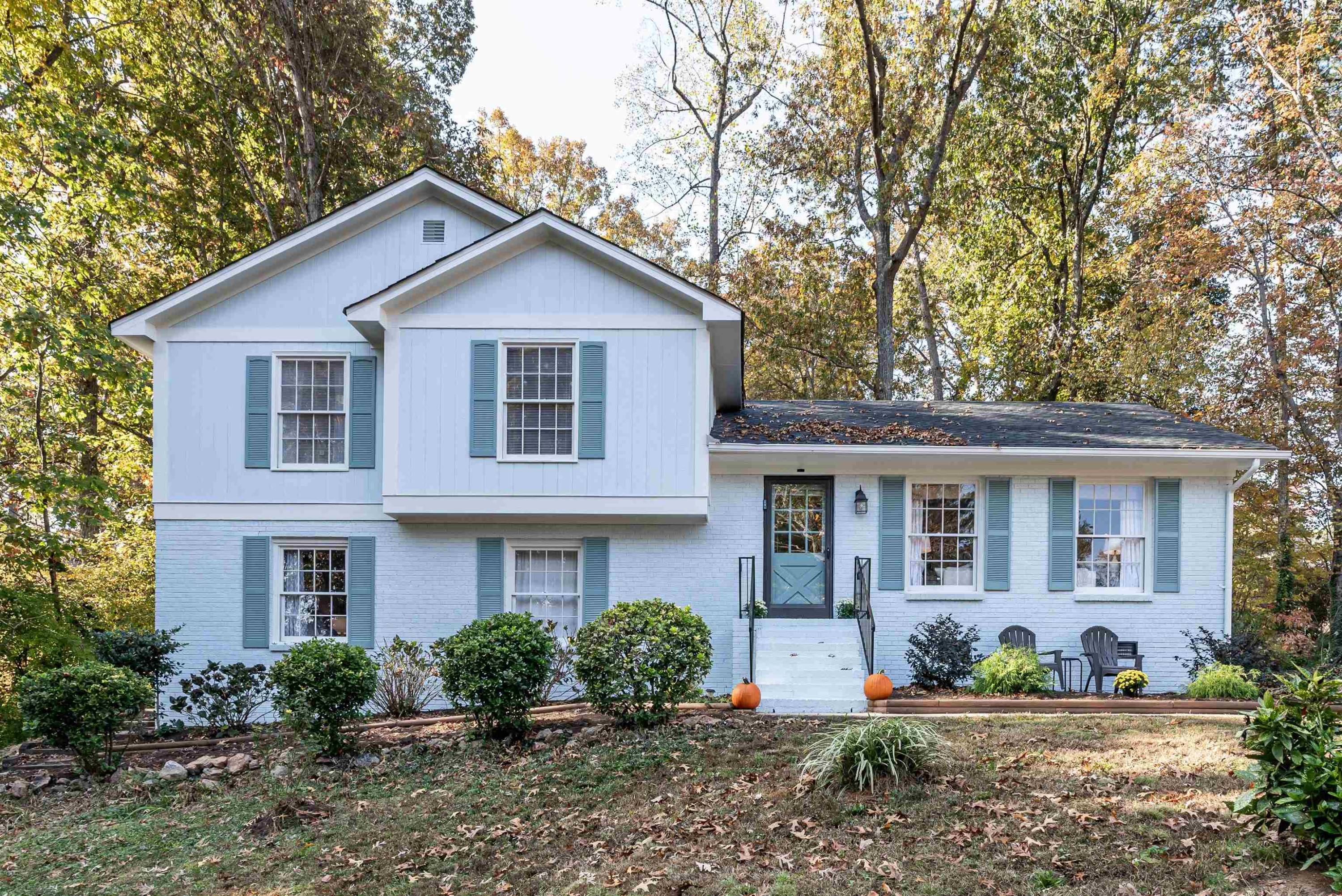 4305 Old Colony Road Raleigh, NC 27613 - Photo 1 of 33 a front view of a house with a yard and potted plants