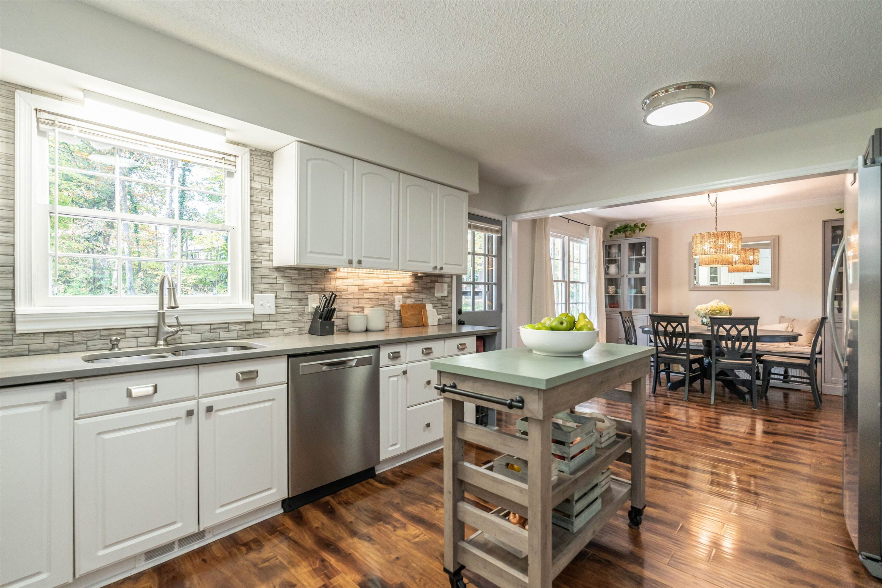 4305 Old Colony Road Raleigh, NC 27613 - Photo 14 of 33 a kitchen with granite countertop lots of counter top space and dining table