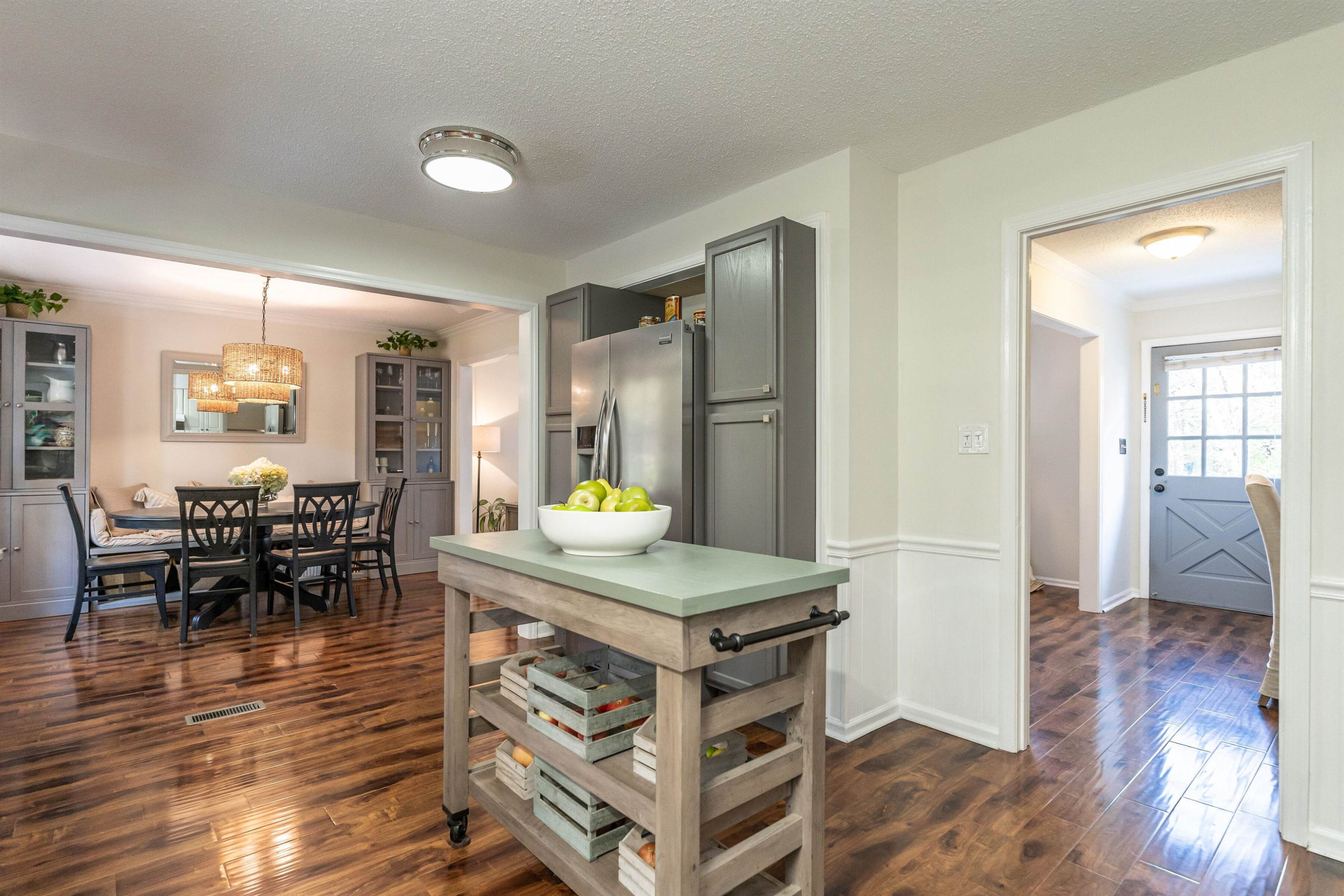 4305 Old Colony Road Raleigh, NC 27613 - Photo 15 of 33 a kitchen with stainless steel appliances granite countertop a stove and a wooden floors