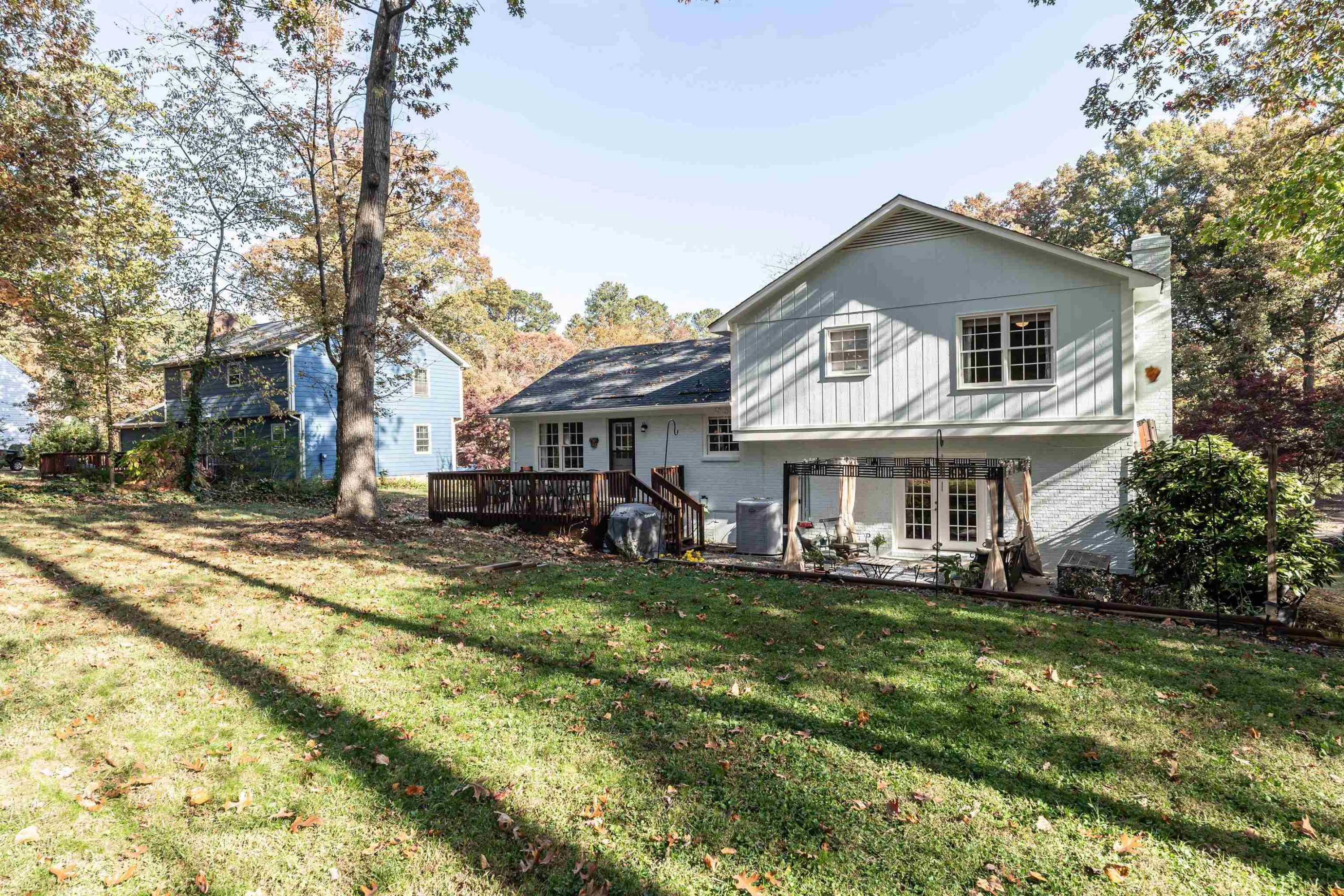 4305 Old Colony Road Raleigh, NC 27613 - Photo 32 of 33 a view of a house with a yard patio and fire pit