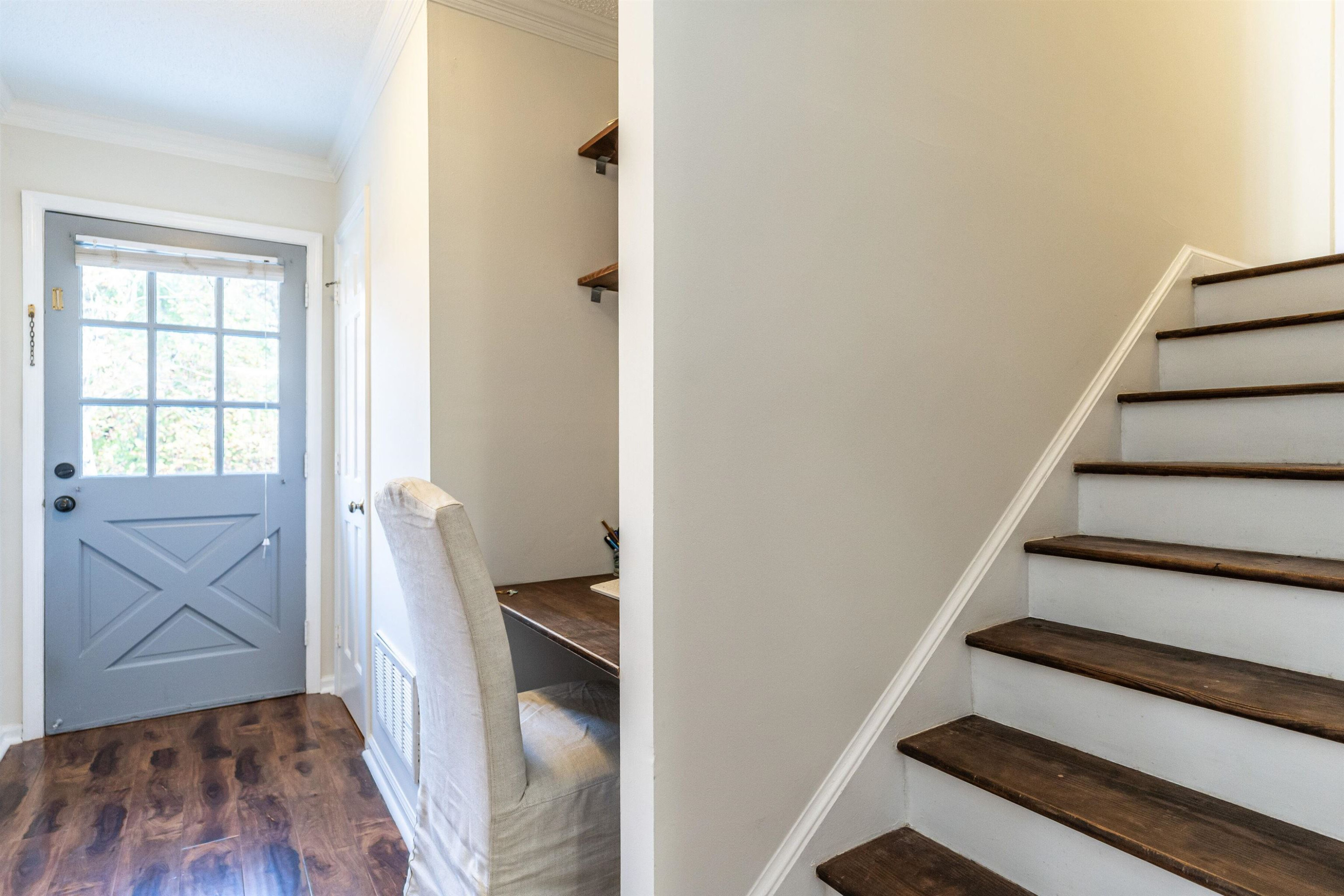 4305 Old Colony Road Raleigh, NC 27613 - Photo 4 of 33 a view of entryway with wooden floor and staircase