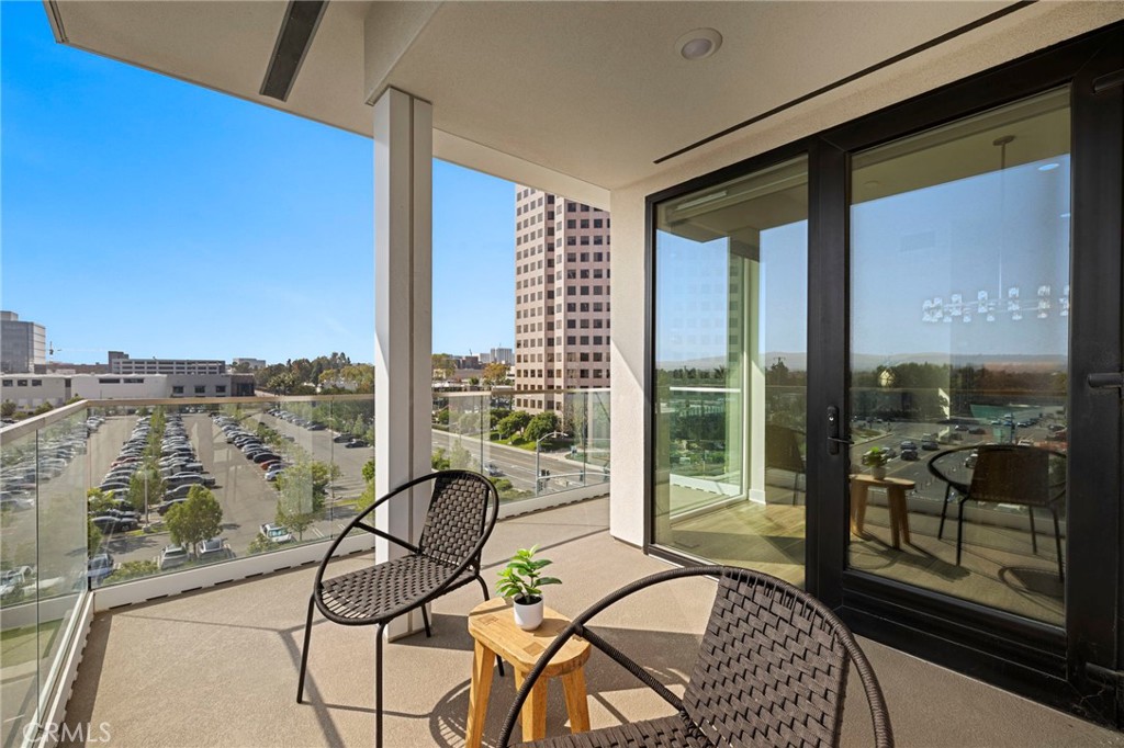 1500 Rivington Irvine, CA 92612 - Photo 11 of 37 a balcony view with a couple of couches and potted plants with sky view