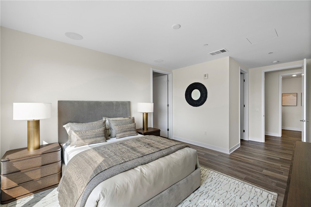 1500 Rivington Irvine, CA 92612 - Photo 15 of 37 a bedroom with a bed and a lamp on table