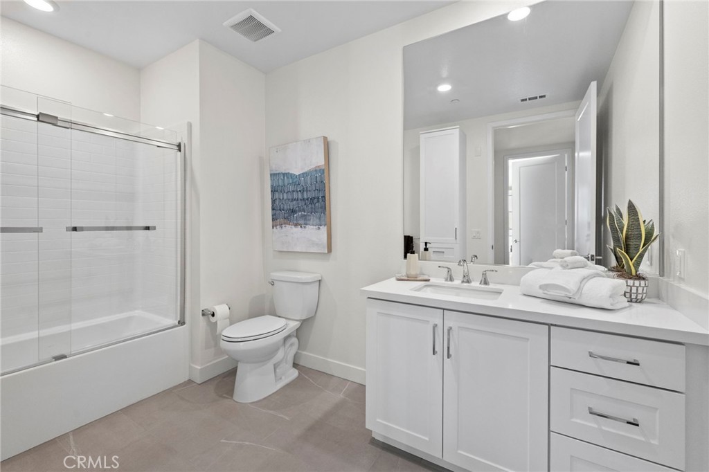 1500 Rivington Irvine, CA 92612 - Photo 25 of 37 a bathroom with a toilet sink and mirror
