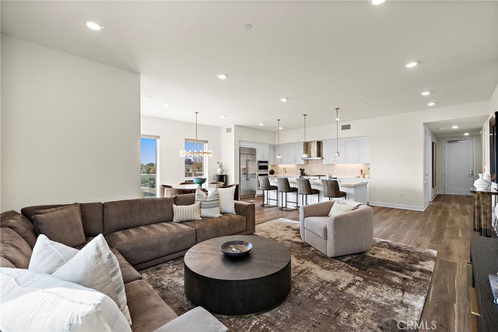 1500 Rivington Irvine, CA 92612 - Photo 3 of 37 a living room with furniture and a view of kitchen