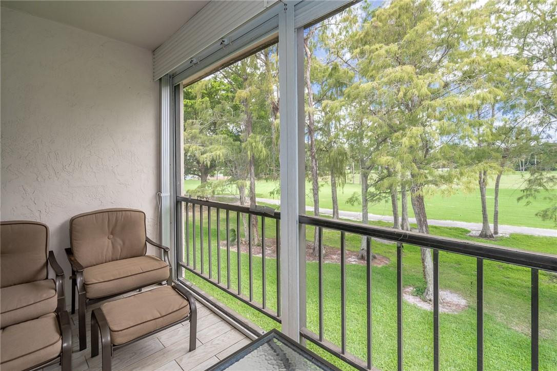 21650 Juego Circle, Unit 24F Boca Raton, FL 33433 - Photo 24 of 24 a balcony with furniture