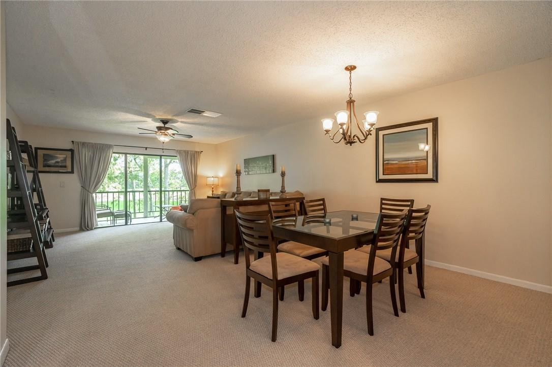 21650 Juego Circle, Unit 24F Boca Raton, FL 33433 - Photo 7 of 24 a dining room with furniture and window