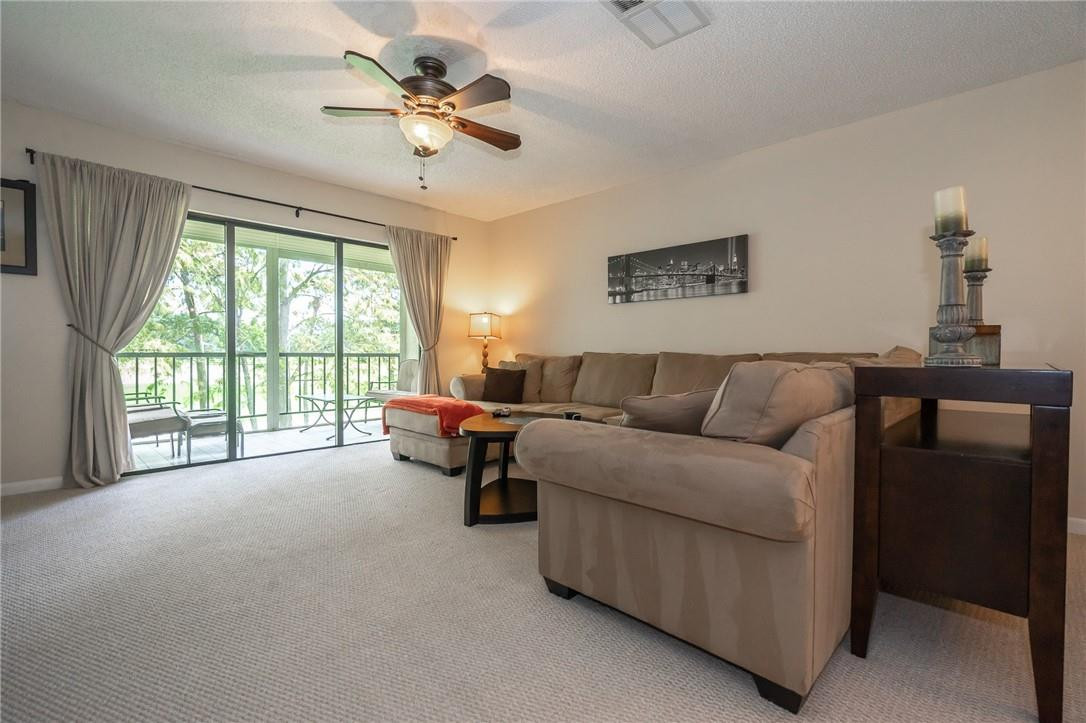 21650 Juego Circle, Unit 24F Boca Raton, FL 33433 - Photo 10 of 24 a living room with furniture and a window