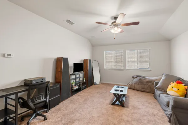 a room with furniture and a window