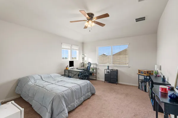 a bed room with a bed and furniture