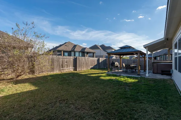 a view of a house with swimming pool and sitting area