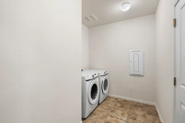 a utility room with dryer and washer