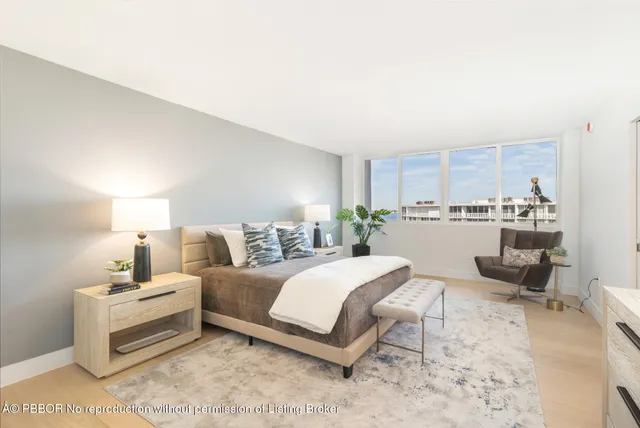 a bedroom with a bed and a view of kitchen