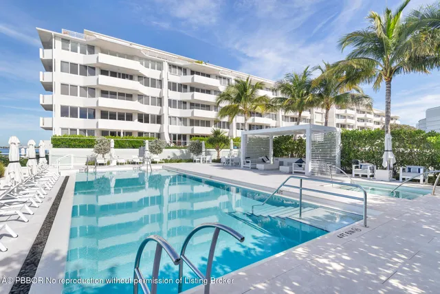 a view of a swimming pool with a patio