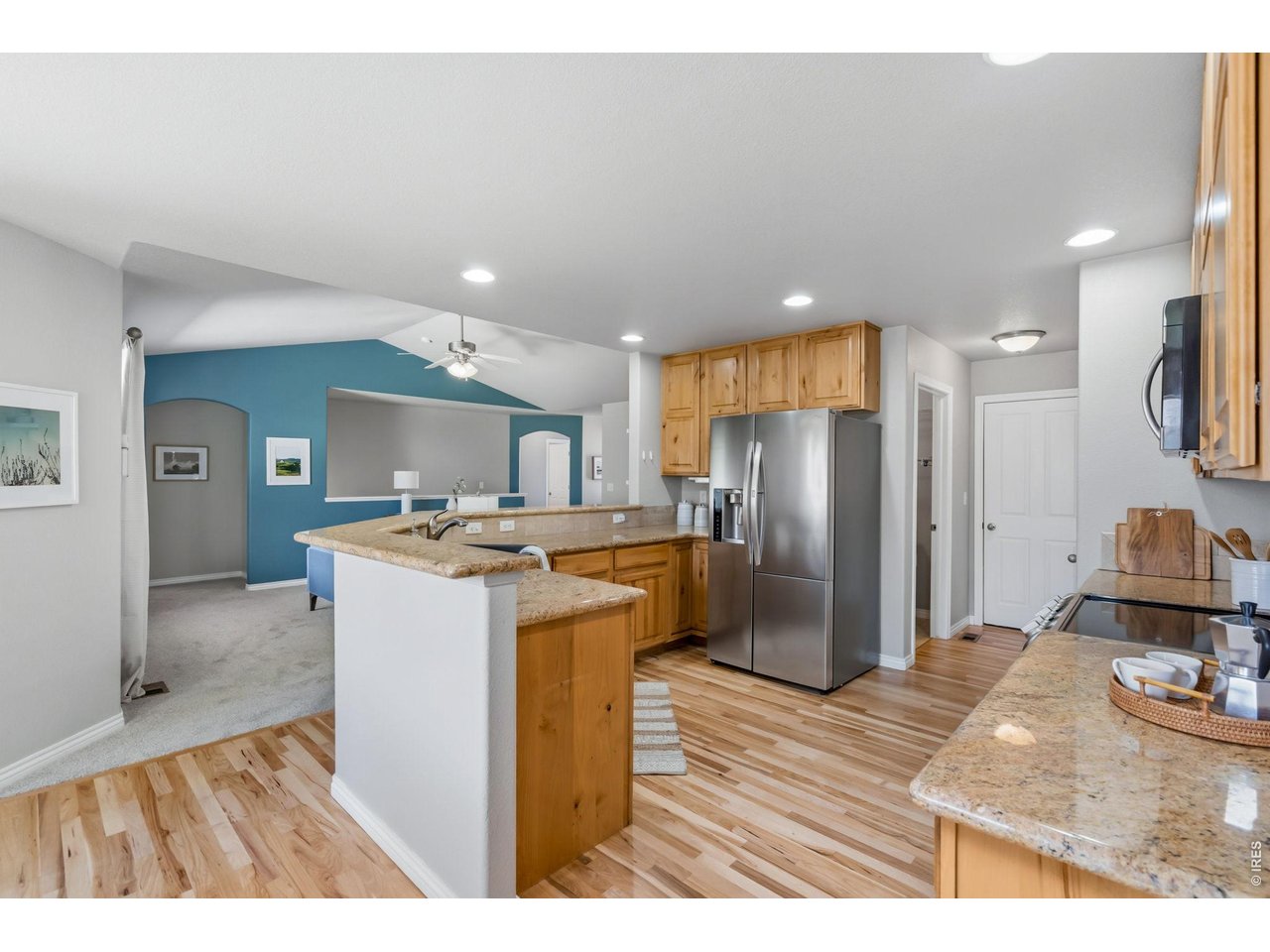 8972 Raging Bull Lane Wellington, CO 80549 - Photo 13 of 45 Kitchen w/ Granite Countertops