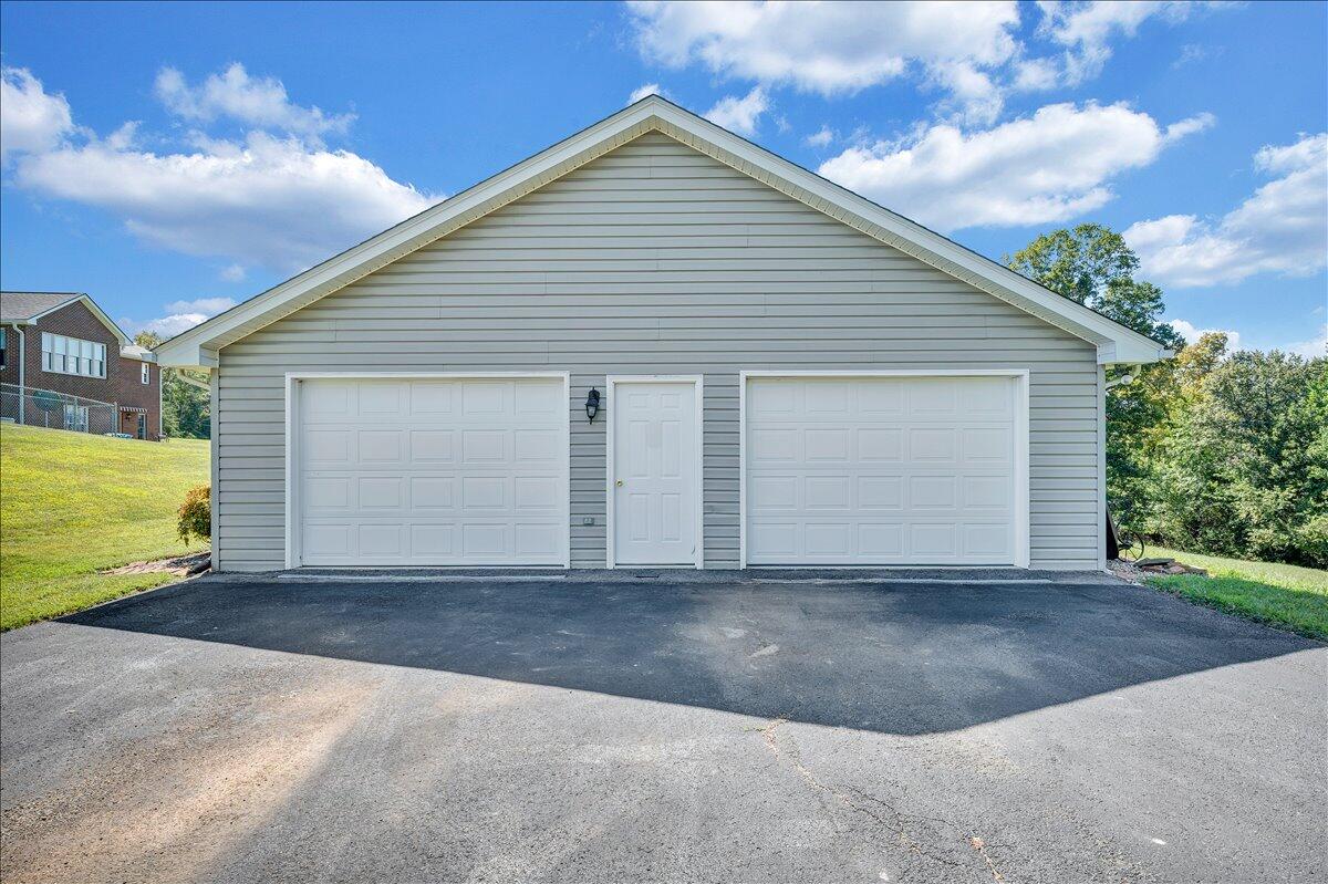 3991 Green Level Road Rocky Mount, VA 24151 - Photo 30 of 49 a view of a house with a yard and garage