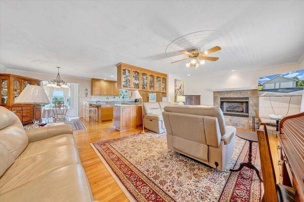 3991 Green Level Road Rocky Mount, VA 24151 - Photo 3 of 49 a living room with furniture and a chandelier