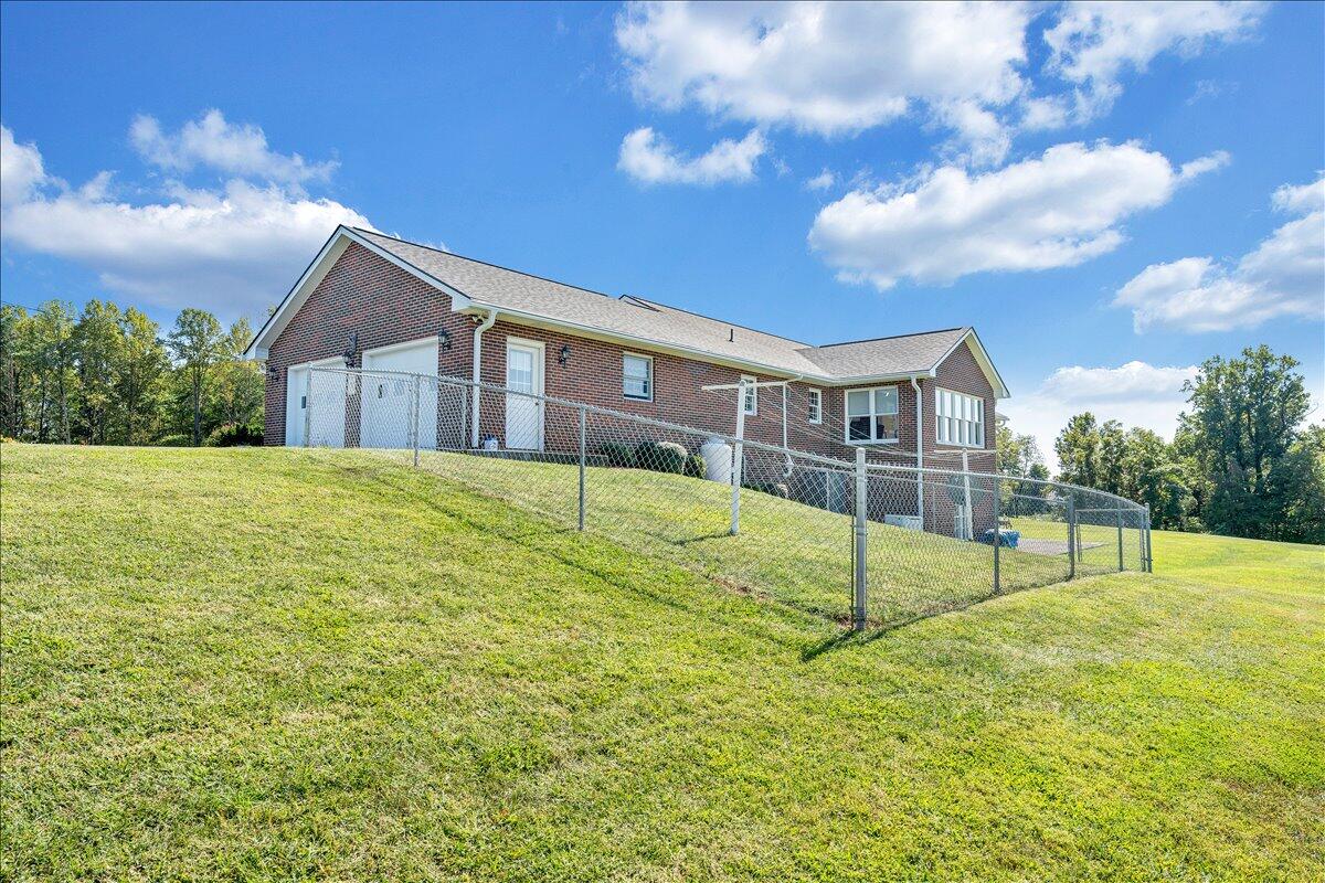 3991 Green Level Road Rocky Mount, VA 24151 - Photo 33 of 49 a view of a house with a backyard and a fire pit