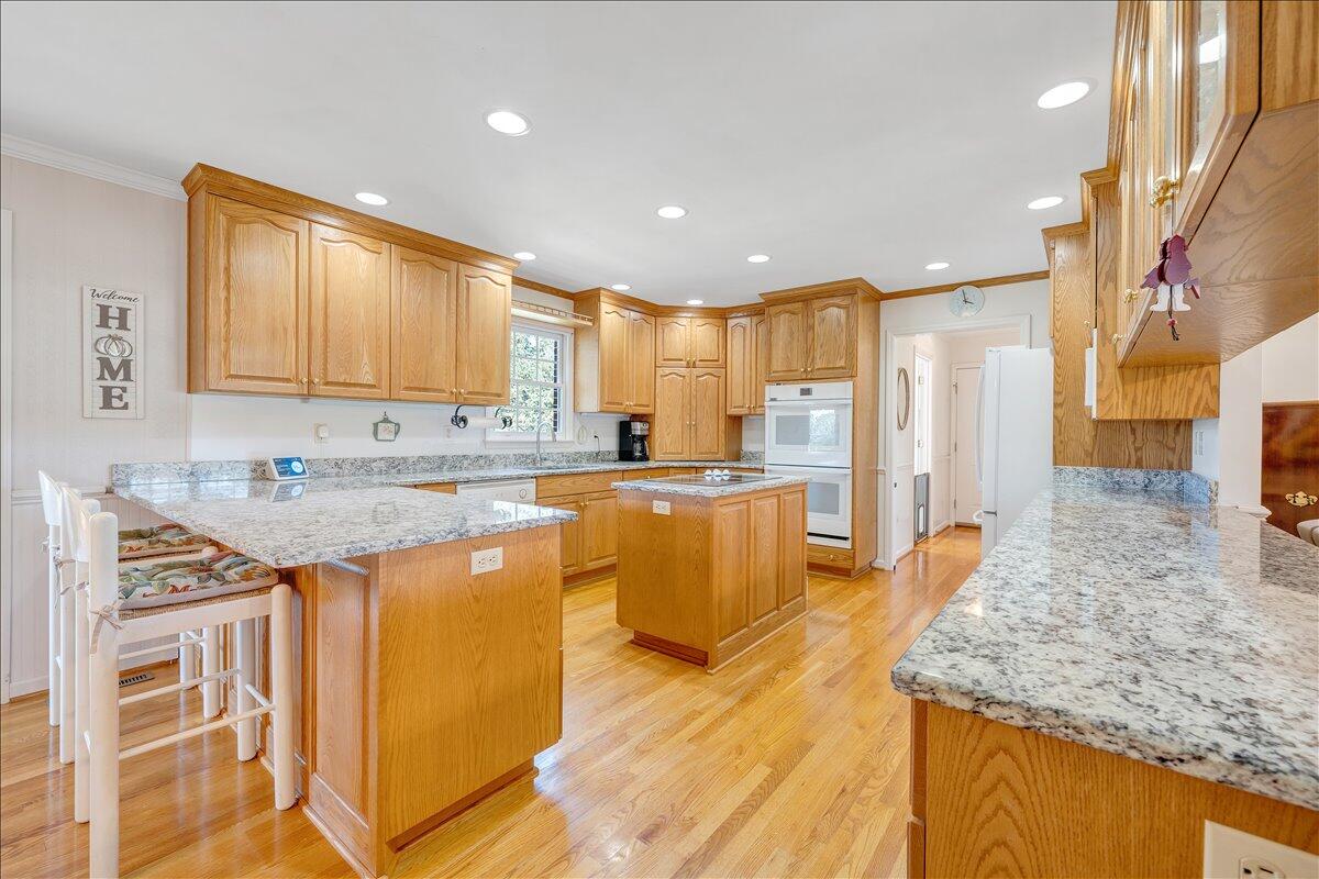 3991 Green Level Road Rocky Mount, VA 24151 - Photo 7 of 49 a kitchen with stainless steel appliances granite countertop a sink stove and refrigerator