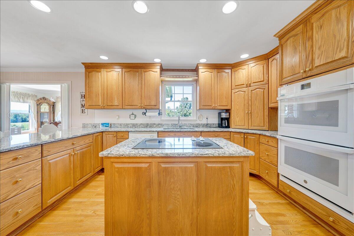 3991 Green Level Road Rocky Mount, VA 24151 - Photo 8 of 49 a kitchen with stainless steel appliances granite countertop a sink and a stove