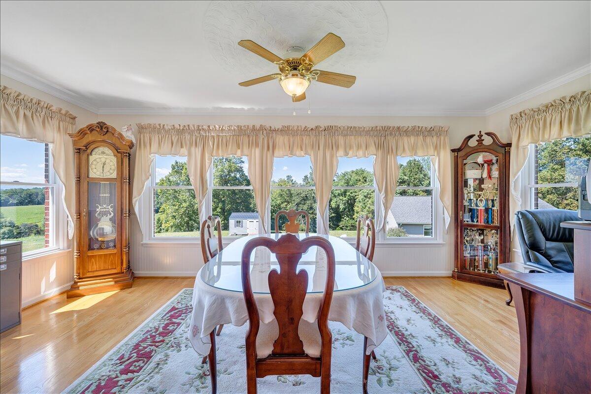3991 Green Level Road Rocky Mount, VA 24151 - Photo 10 of 49 a view of a dining room with furniture window and wooden floor