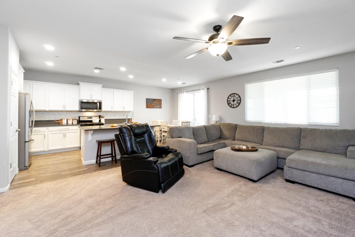 14340 West David Avenue Kerman, CA 93630 - Photo 11 of 30 a living room with furniture kitchen and a window