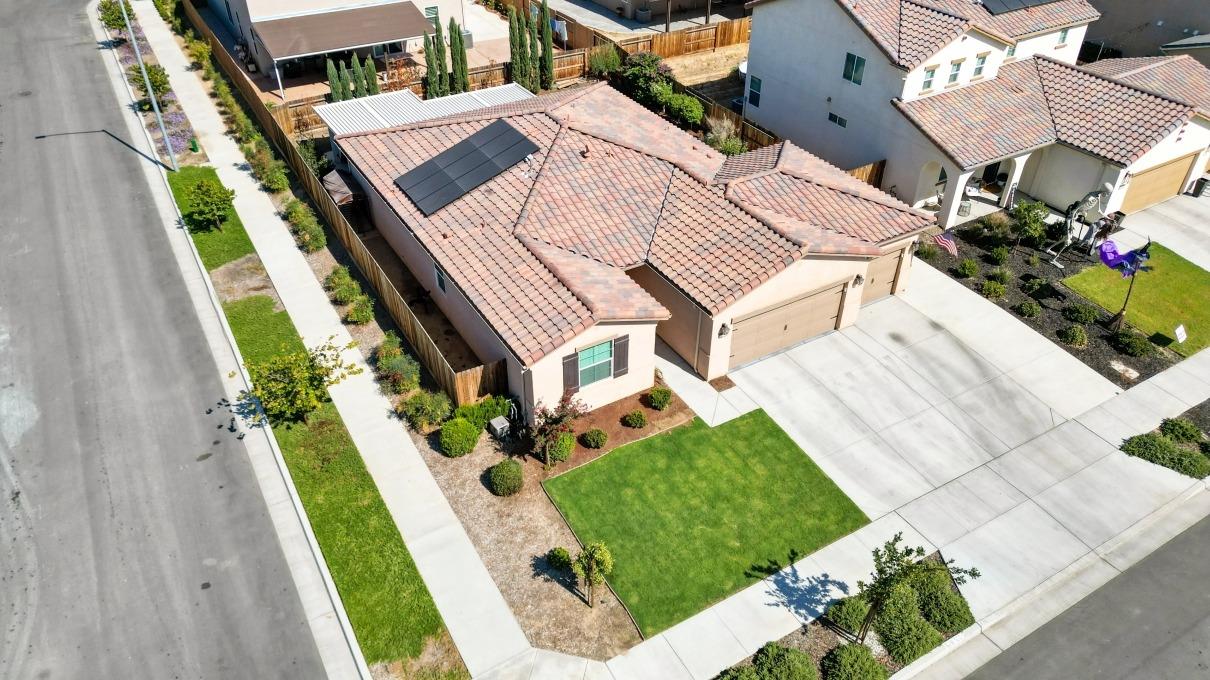 14340 West David Avenue Kerman, CA 93630 - Photo 2 of 30 an aerial view of a house with a garden