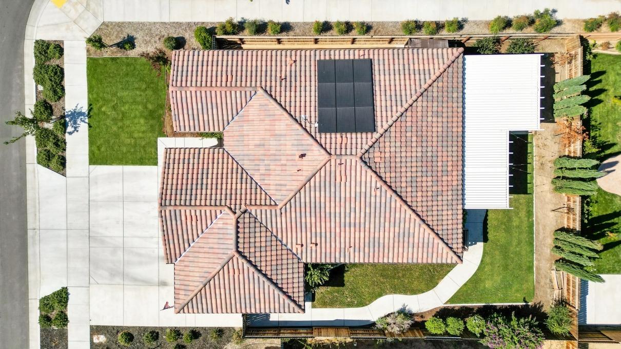 14340 West David Avenue Kerman, CA 93630 - Photo 3 of 30 an aerial view of a house with swimming pool and bench