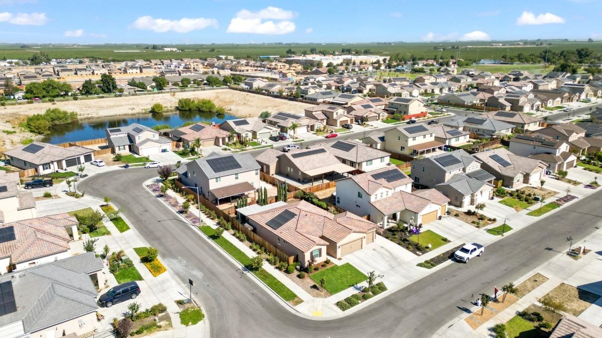14340 West David Avenue Kerman, CA 93630 - Photo 4 of 30 an aerial view of residential houses with outdoor space