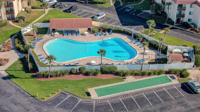 a view of a white house with a yard