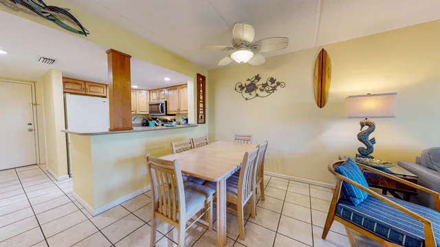 a kitchen with a table and chairs in it