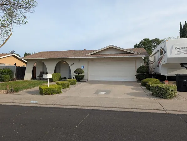 a front view of a house with garage
