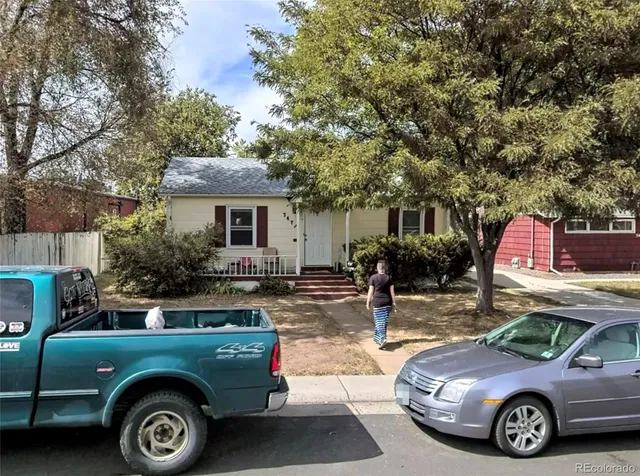 a front view of a house with parking space