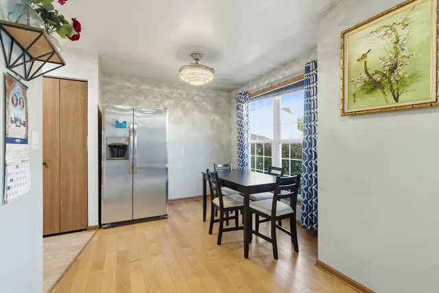 a view of a dining room with furniture window and wooden floor