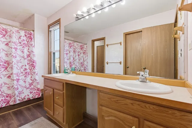 a white toilet sitting next to a shower curtain