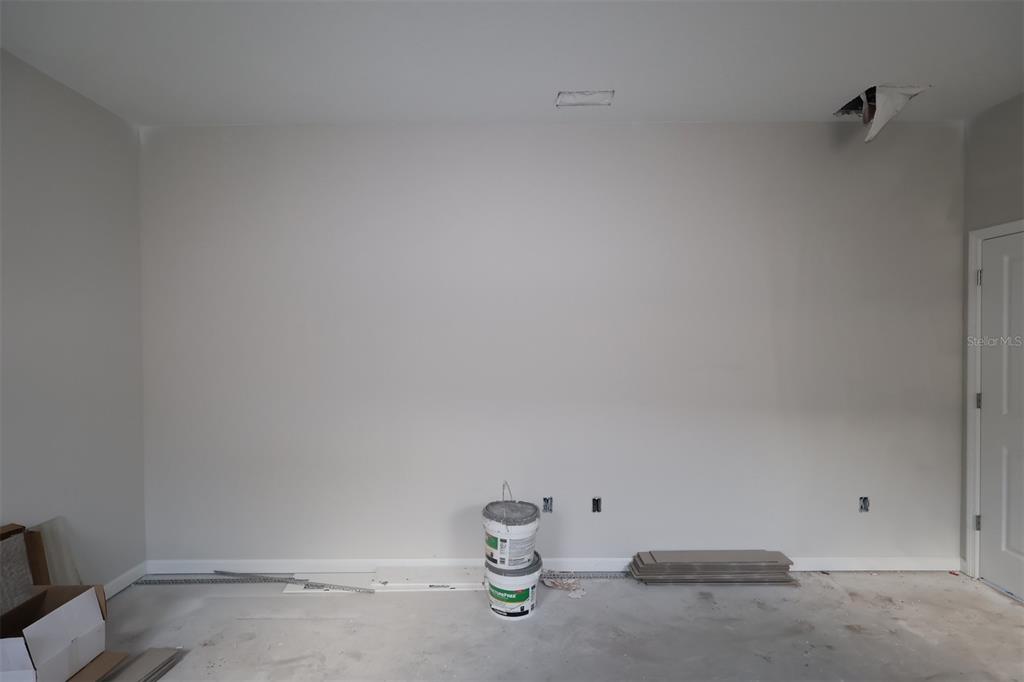 5291 High Line Drive St. Cloud, FL 34771 - Photo 13 of 24 a view of storage and utility room with empty racks