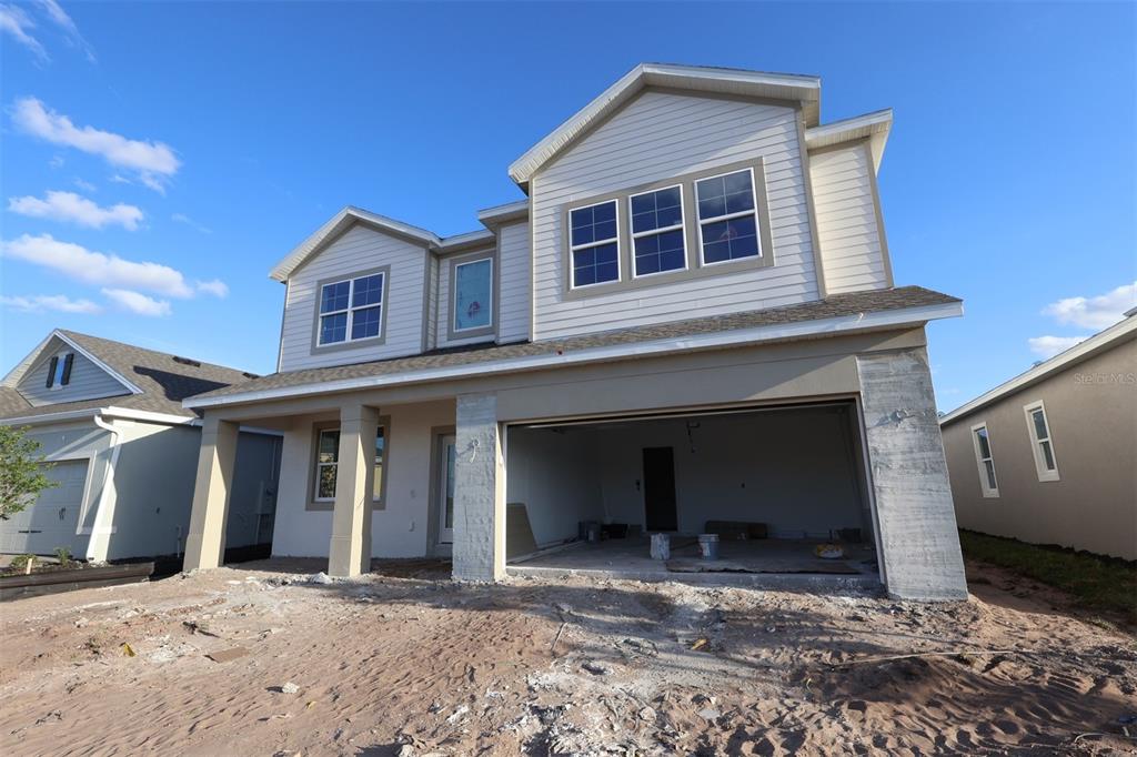 5291 High Line Drive St. Cloud, FL 34771 - Photo 20 of 24 a front view of a house with a yard
