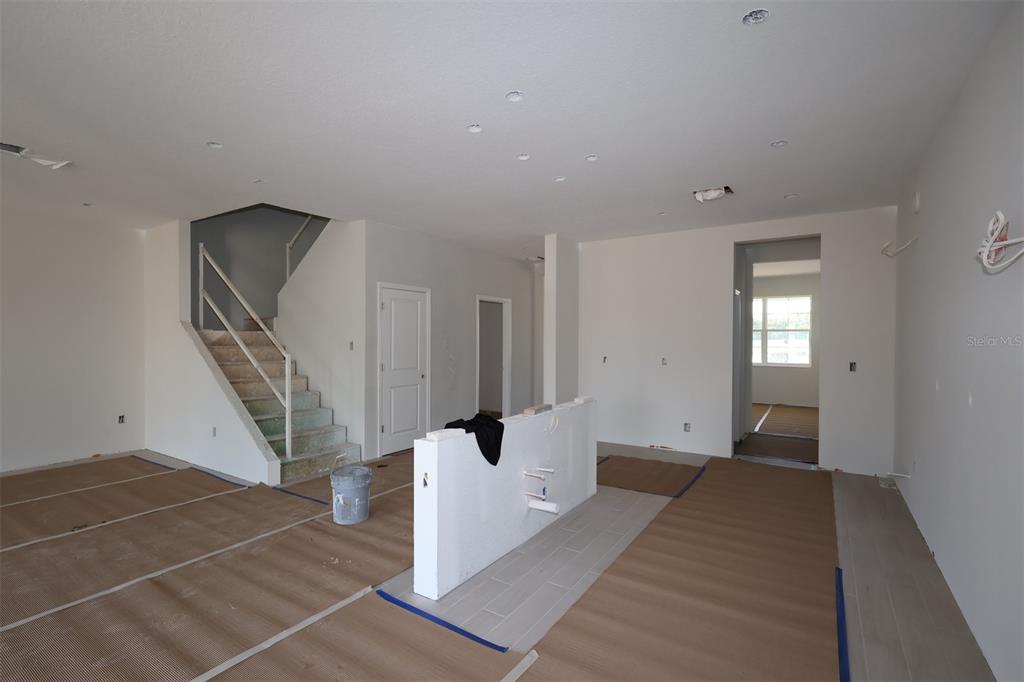 5291 High Line Drive St. Cloud, FL 34771 - Photo 3 of 24 a view of an entryway with wooden floor and stairs
