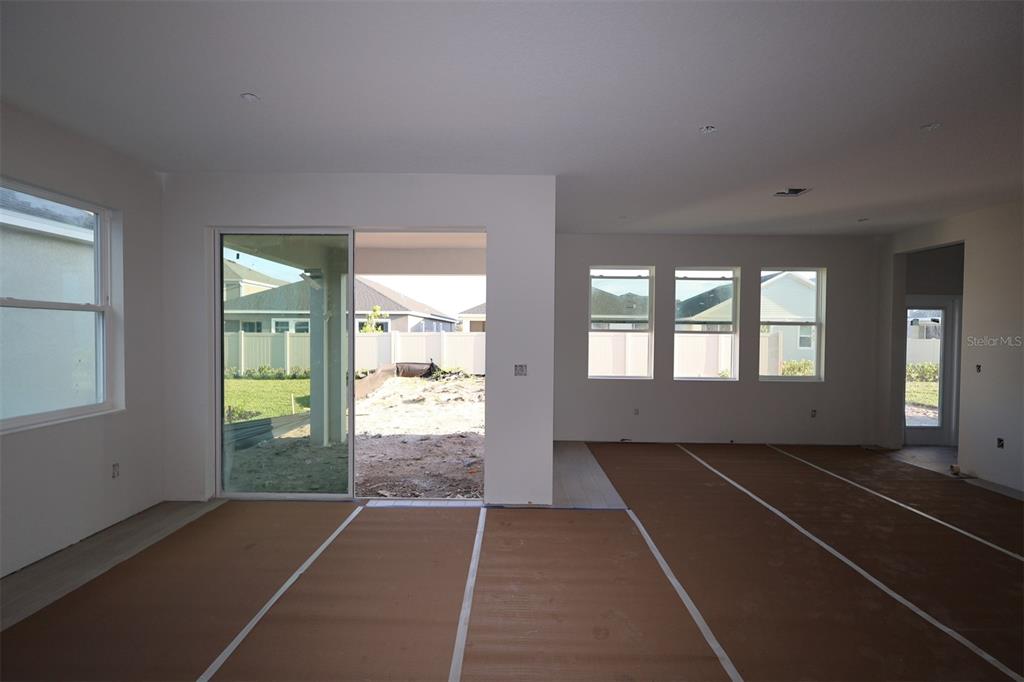 5291 High Line Drive St. Cloud, FL 34771 - Photo 8 of 24 a view of an empty room with glass door