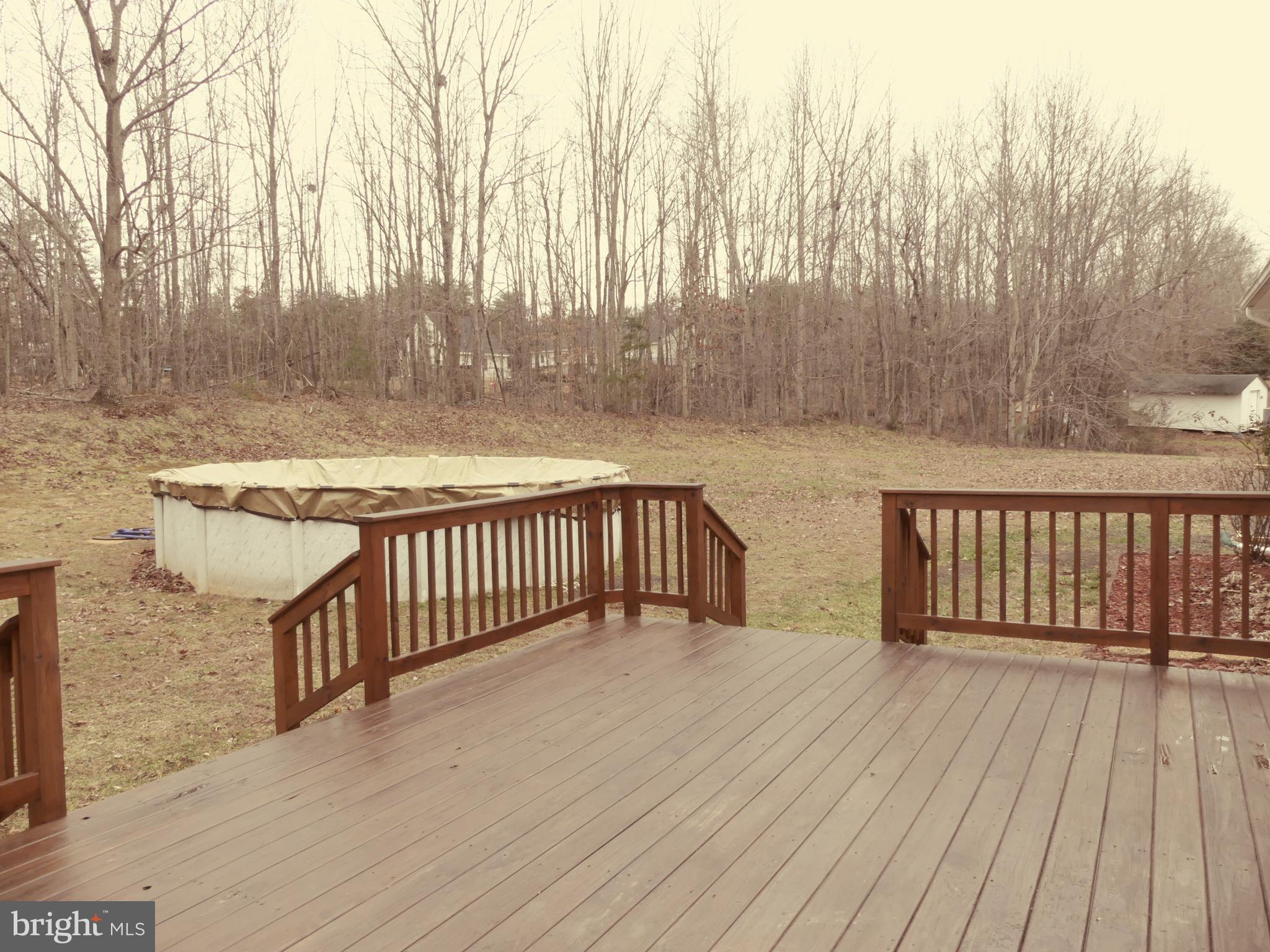 34056 Ridge View Drive Locust Grove, VA 22508 - Photo 26 of 29 Back deck and above ground pool