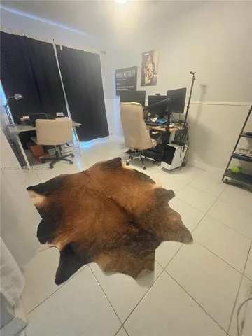 a workspace with furniture and mirror