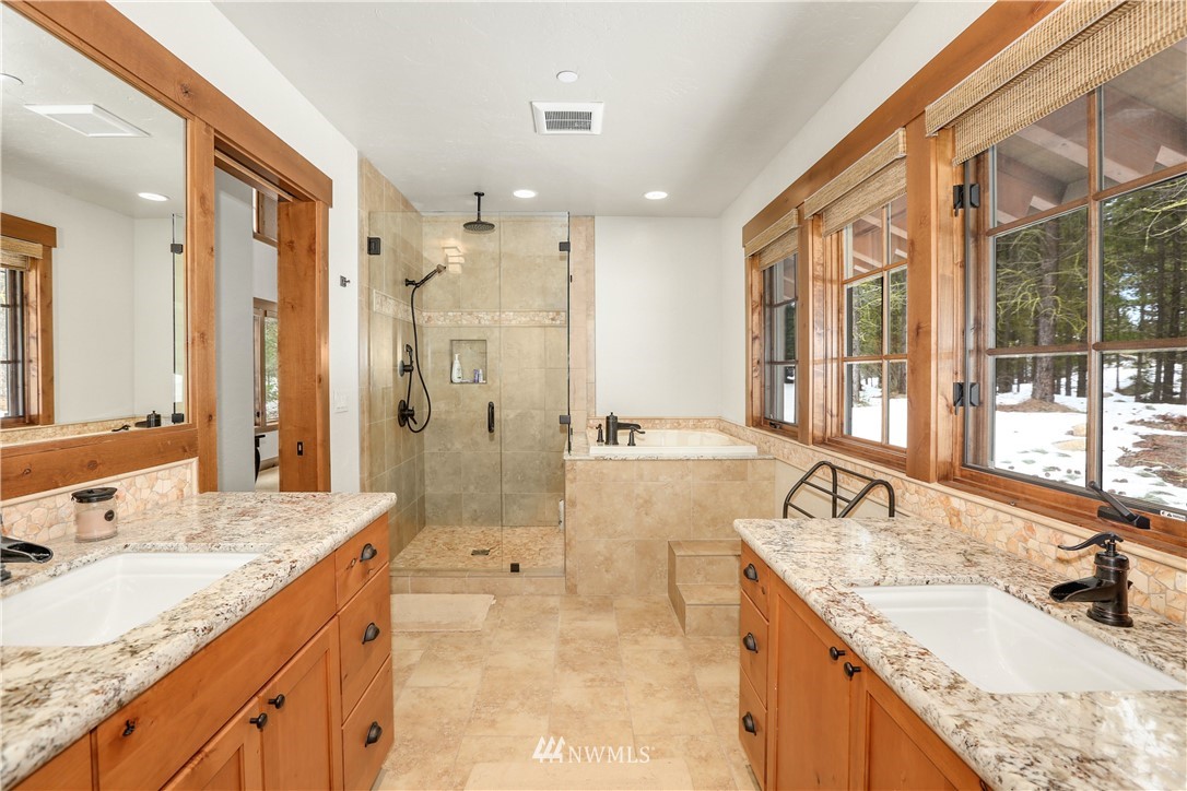 51 Rushing Water Lane Cle Elum, WA 98922 - Photo 13 of 28 a spacious bathroom with a granite countertop sink mirror and double