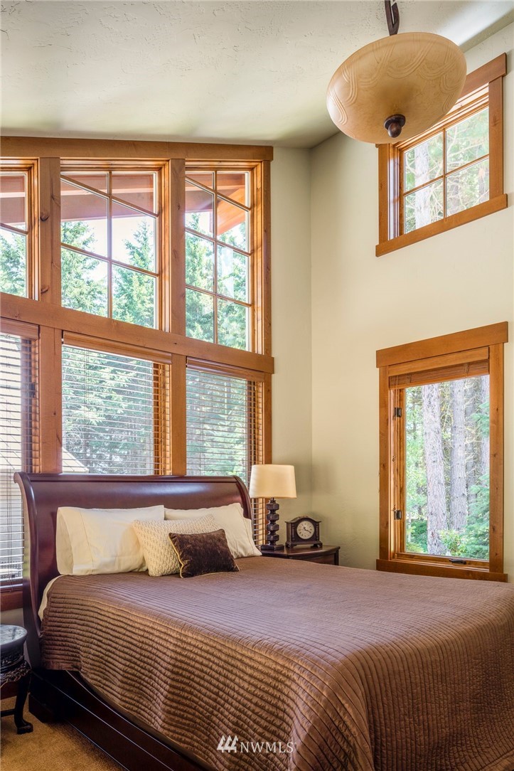 51 Rushing Water Lane Cle Elum, WA 98922 - Photo 14 of 28 a bedroom with a bed and window
