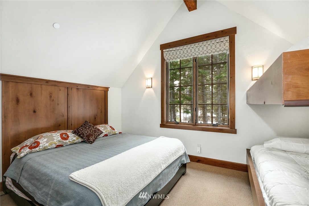 51 Rushing Water Lane Cle Elum, WA 98922 - Photo 24 of 28 a bedroom with a bed and a window