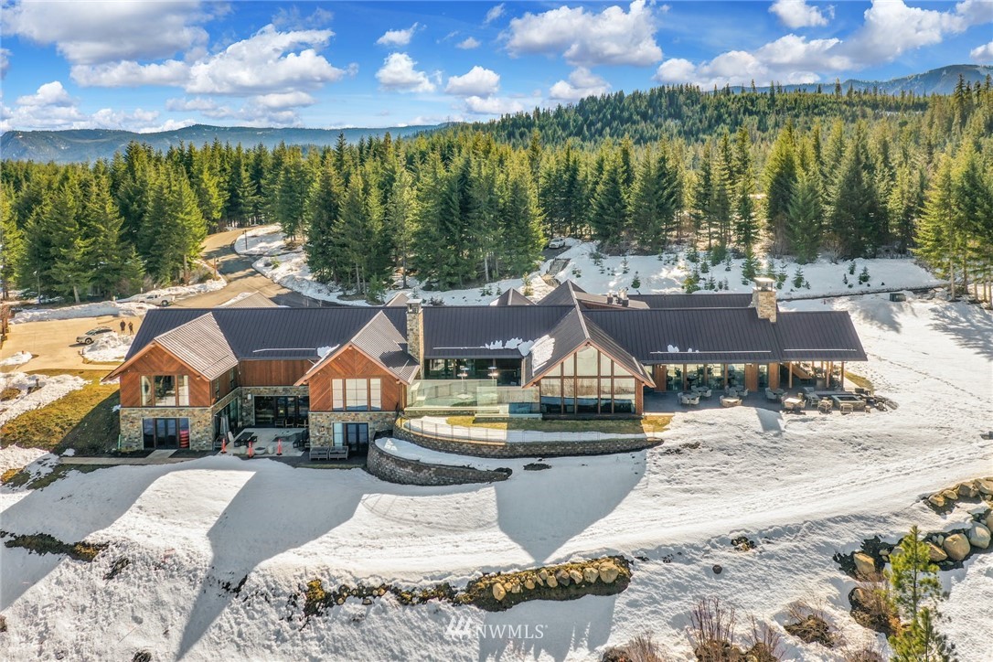 51 Rushing Water Lane Cle Elum, WA 98922 - Photo 27 of 28 a view of a house with pool and lake view