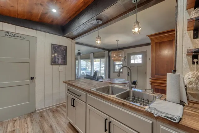 a kitchen with a sink and refrigerator