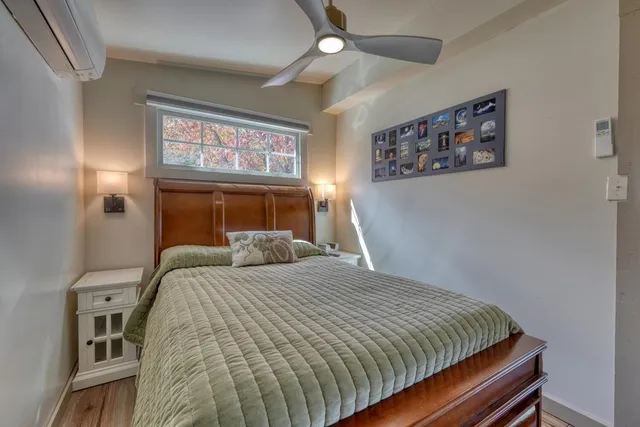 a bedroom with a bed and a window