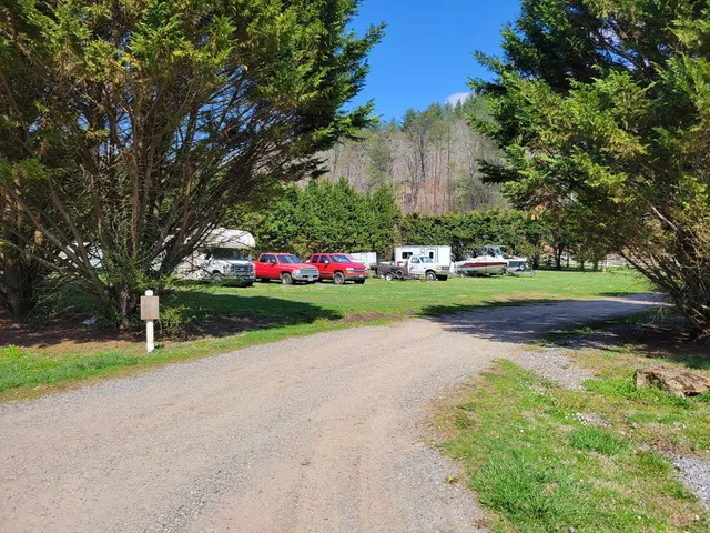 a view of garden with flowers and trees