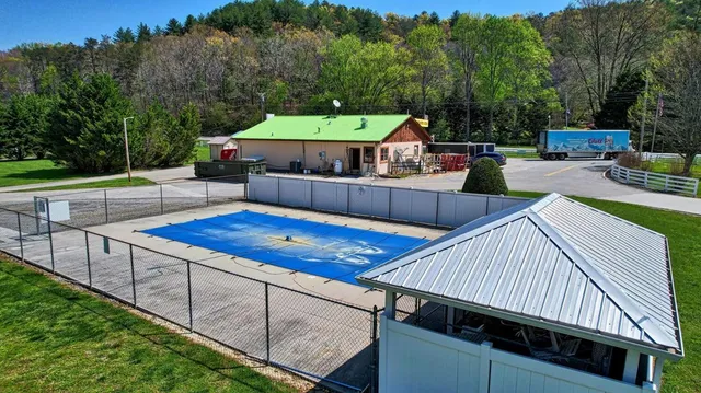 a view of a roof deck with furniture