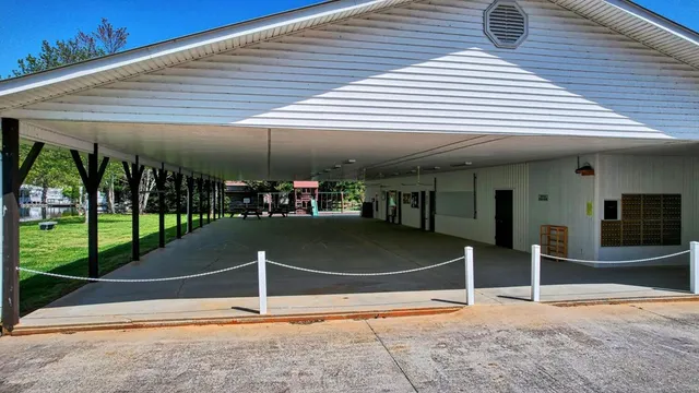 a room with lots of windows and plants